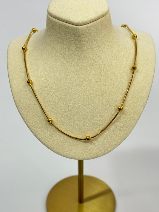 Stunning Gold Steel Necklace with Intricate Dorika Details