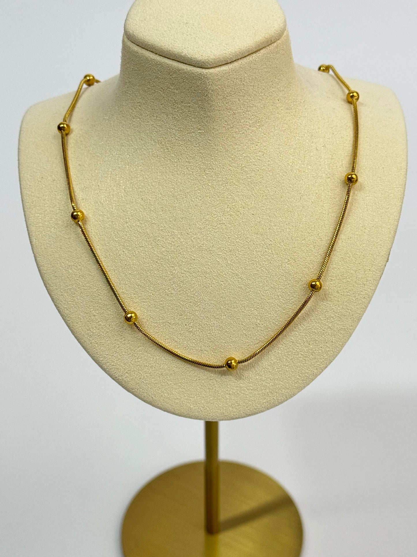 Stunning Gold Steel Necklace with Intricate Dorika Details