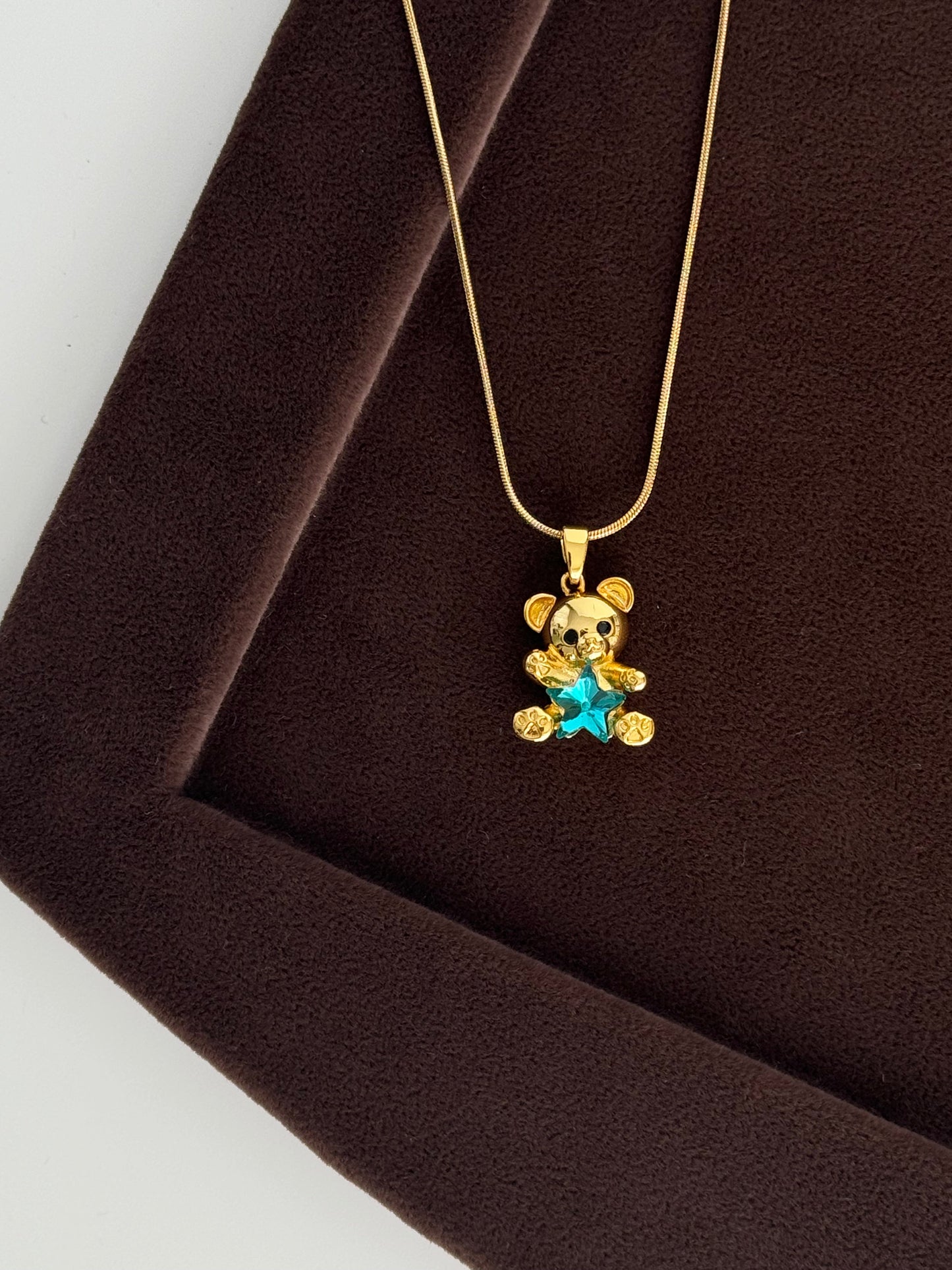 Detailed Gold Steel Necklace with Adorable Charm