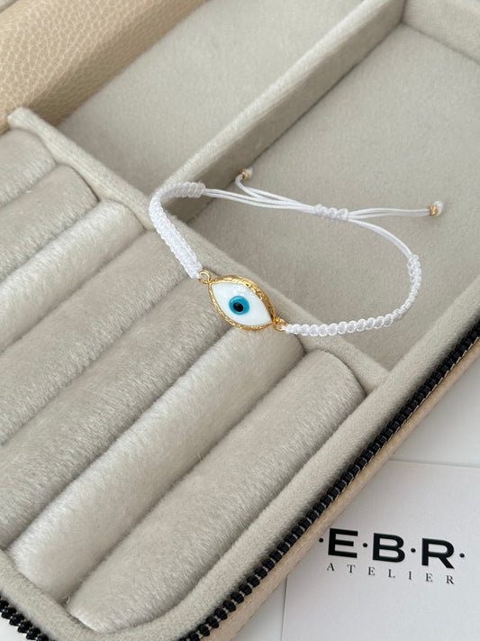 Elegant White Glass Evil Eye Bracelet with Gold-Plated Accents