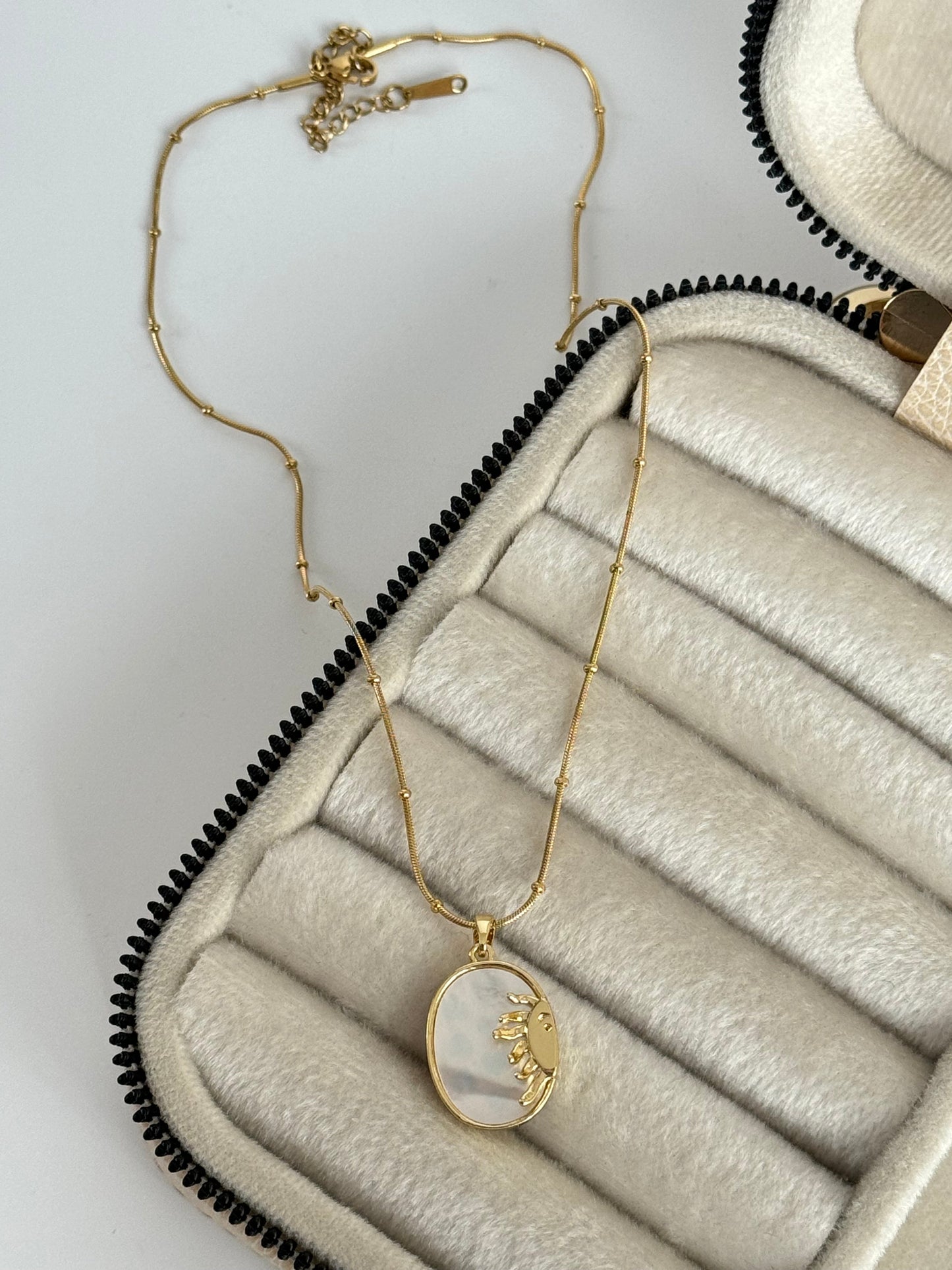 Sun-Inspired Gold Steel Necklace with Intricate Details