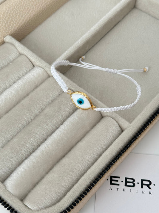 Elegant White Glass Evil Eye Bracelet with Gold-Plated Accents